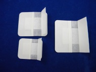 Adhesive wound dressing