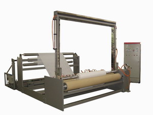 Nonwoven slitting and rewinding machine